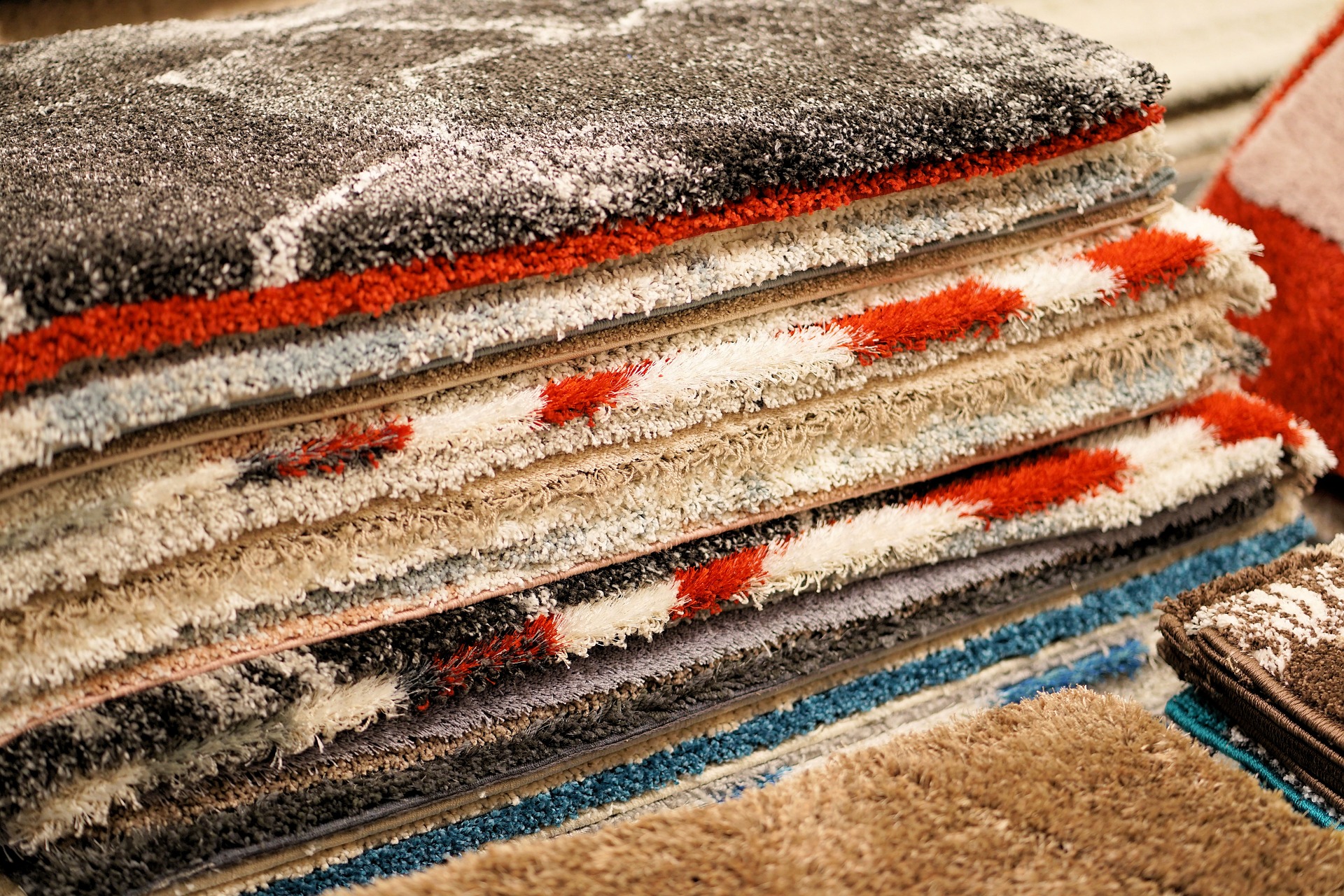 image of a pile of different carpets