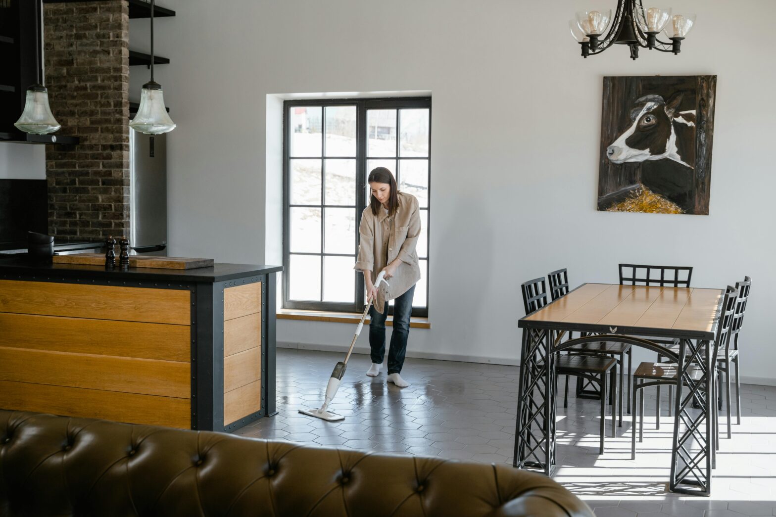 image of a woman mopping a floor